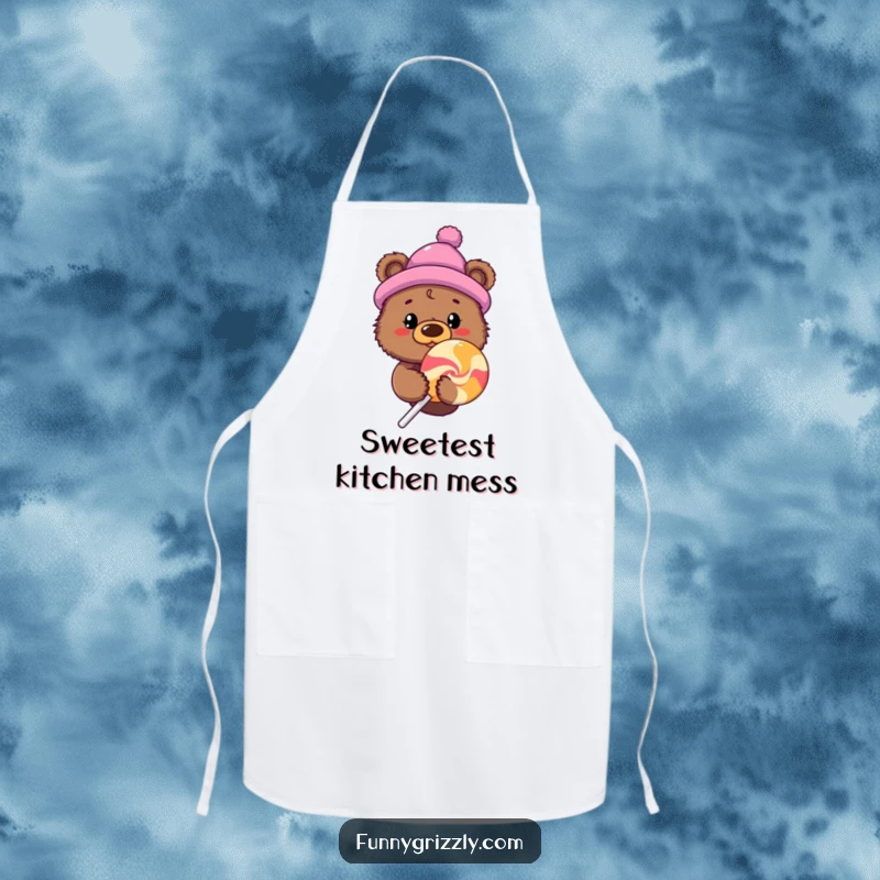 Funny curious grizzly bear in a novelty hat peeking from behind a giant lollipop on a functional and humorous apron.