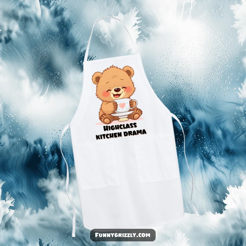 Funny apron showing a giggling grizzly bear cub attempting to balance a teacup on its head, adding humor to kitchen duties.