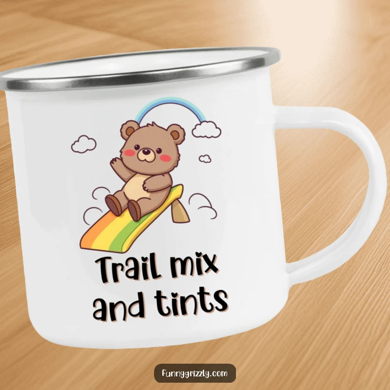 Funny camping mug with a cheerful grizzly bear sliding down a vibrant rainbow, designed for outdoor fun and warm beverages.