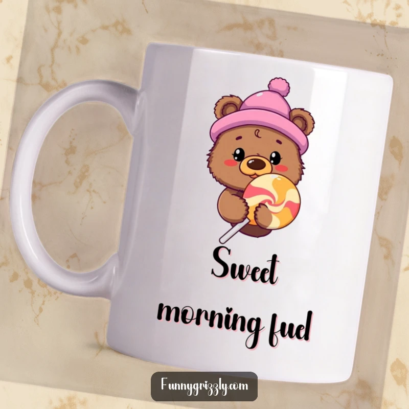 Funny grizzly bear in a novelty hat peeking from behind a giant lollipop on a humorous mug.