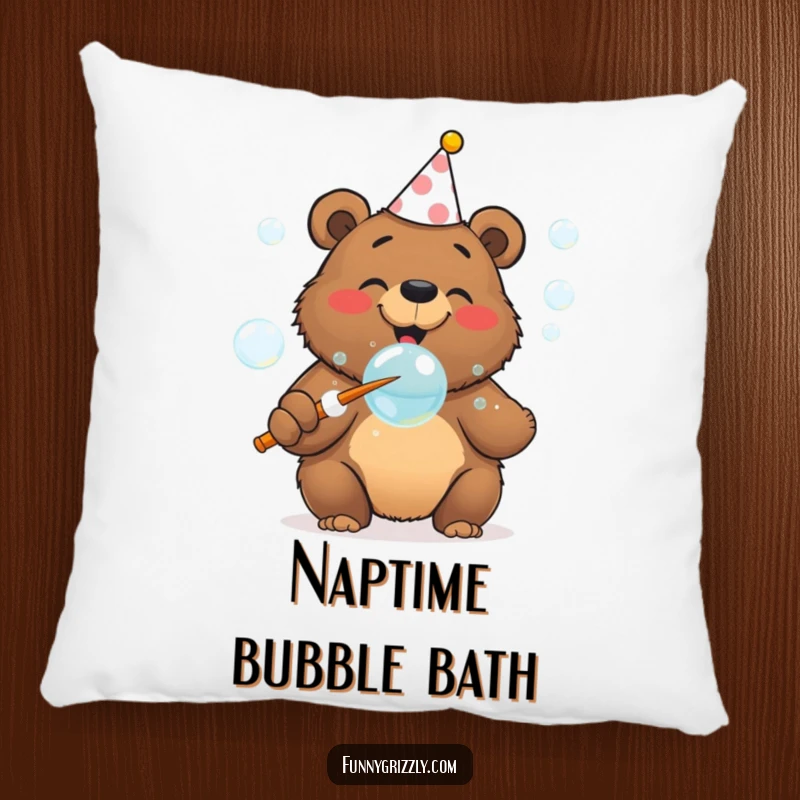 Funny cheerful grizzly bear in a party hat blowing bubbles with a giant wand, featured on a plush and humorous pillow.