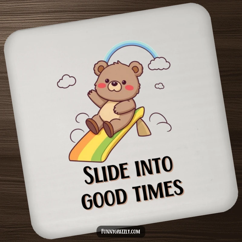 Funny drink coaster featuring a happy grizzly bear sliding down a colorful rainbow, adding whimsical protection to any tabletop.
