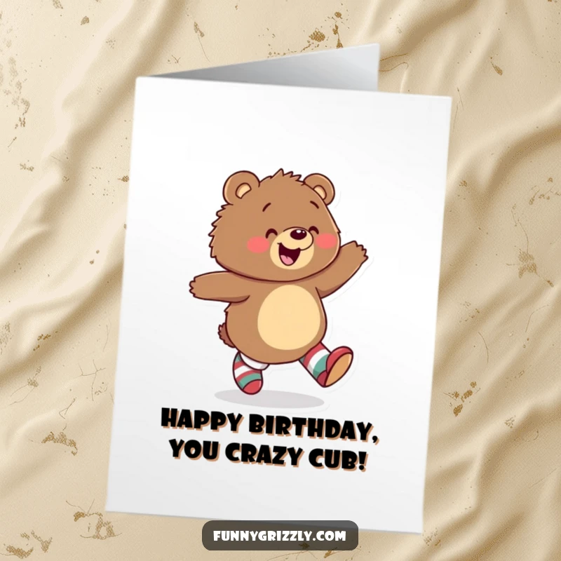 Funny Free Printable Birthday Card: A playful grizzly bear skips with glee, sporting mismatched socks, radiating pure, uninhibited joy. Downloadable gift.