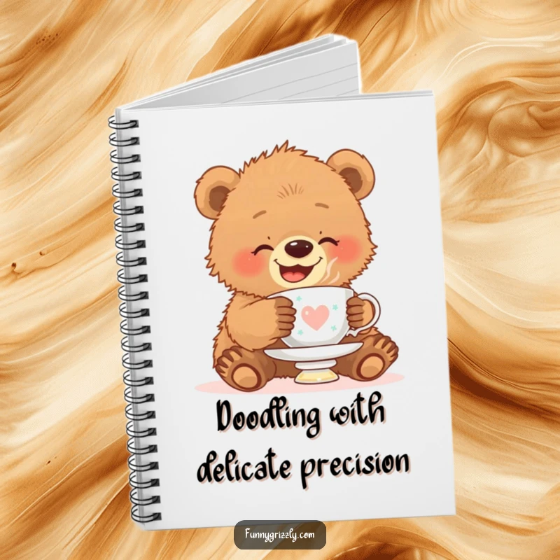 Funny notebook featuring a giggling grizzly bear cub attempting to balance a teacup on its head, perfect for jotting down sweet thoughts.