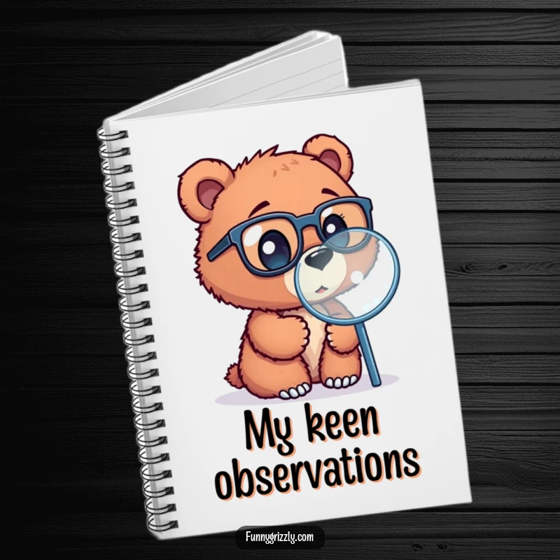 Funny notebook cover featuring a curious grizzly bear cub with glasses, looking through a magnifying glass, ideal for jotting ideas.