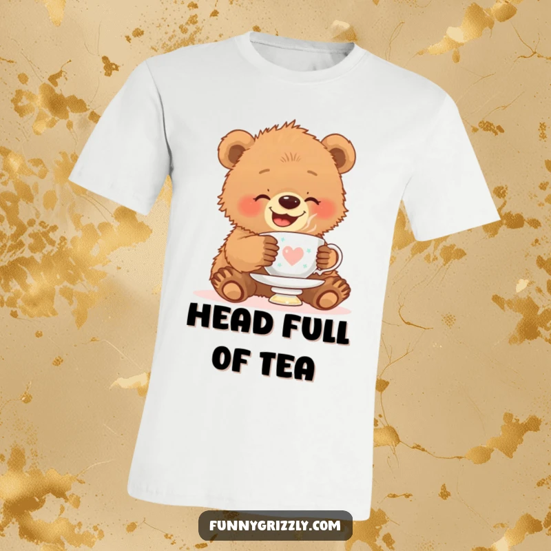 Funny t-shirt of a giggling grizzly bear cub trying to balance a teacup on its head, showcasing playful struggle and charm.