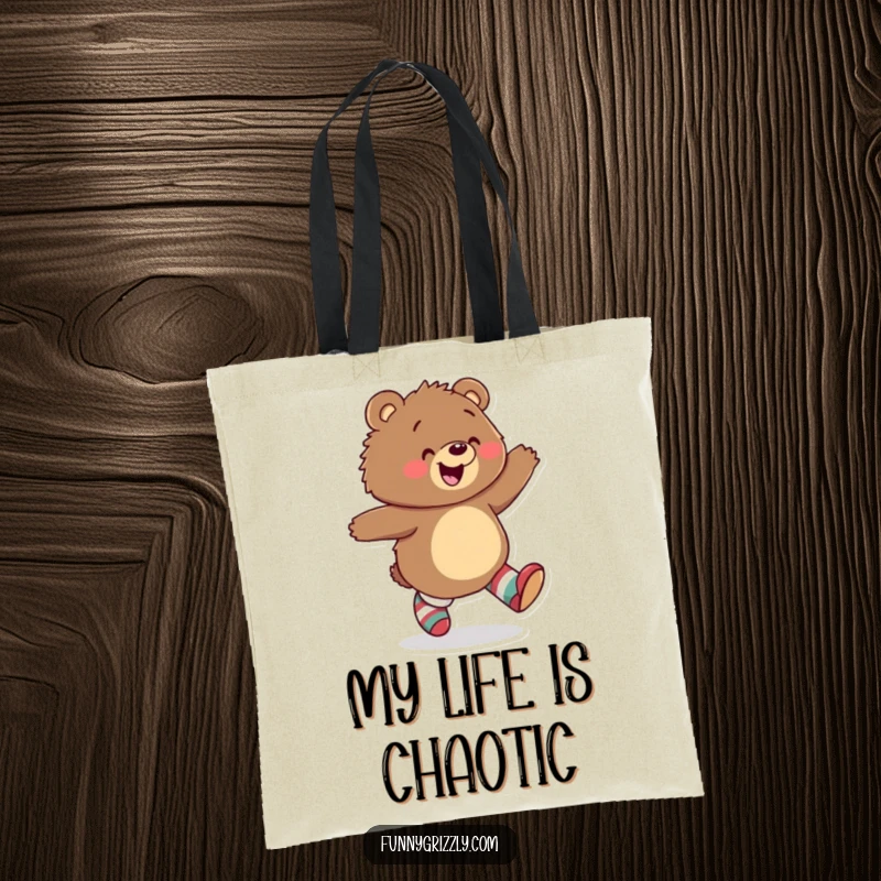 Funny tote bag depicting a joyful grizzly bear skipping happily while wearing mismatched socks, ideal for carrying daily items with flair.